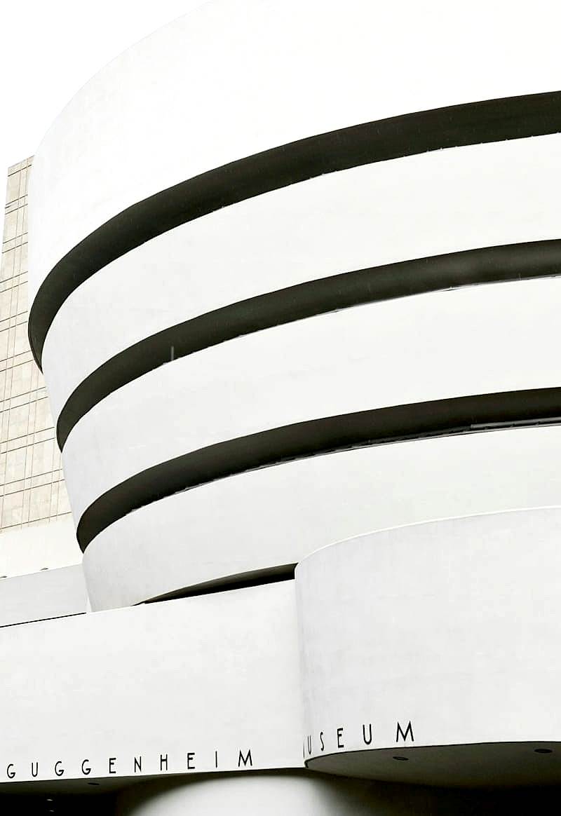 Exterior of the Guggenheim Museum in New York City, a unique spiral-shaped building designed by Frank Lloyd Wright.