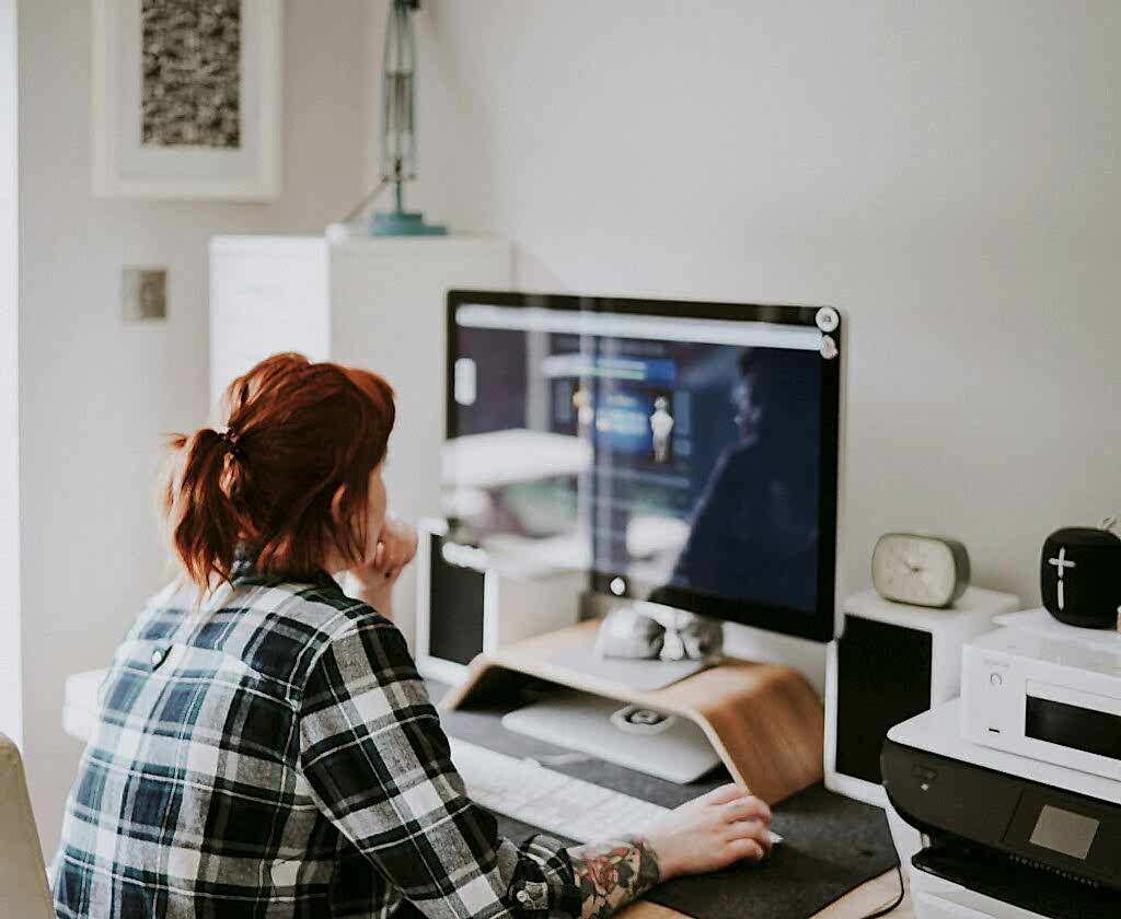 Woman sitting at a desk using her computer