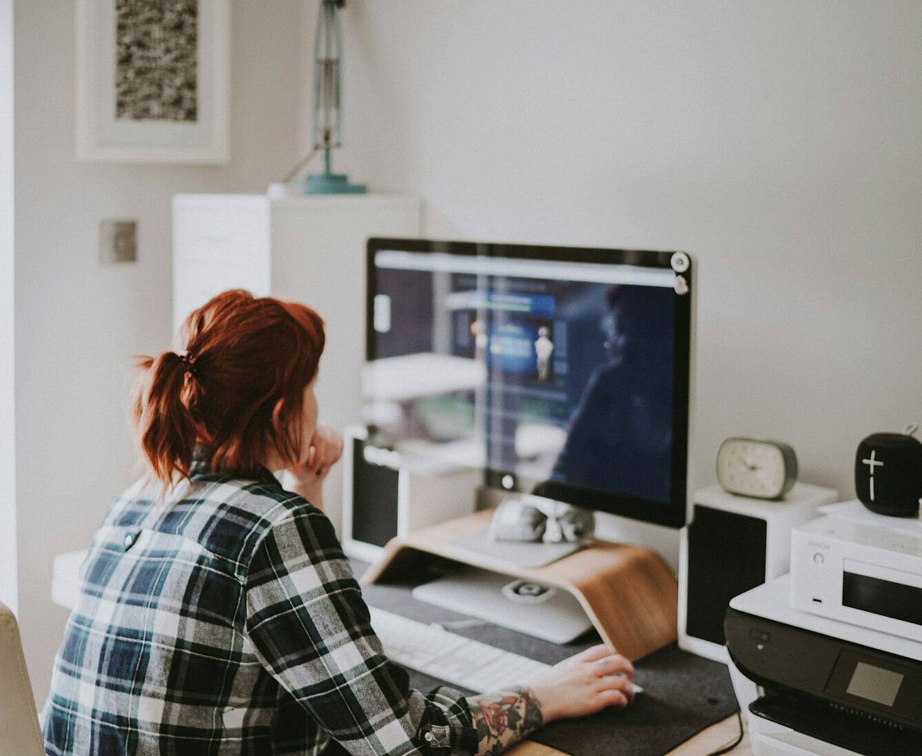 Woman sitting at a desk using her computer