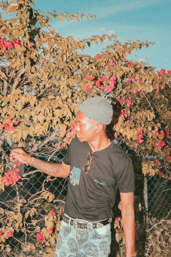 Man standing in front of a fall tree