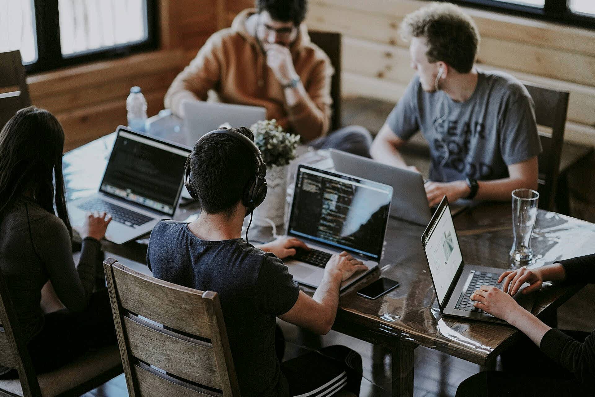 A group of people on laptops during a working session