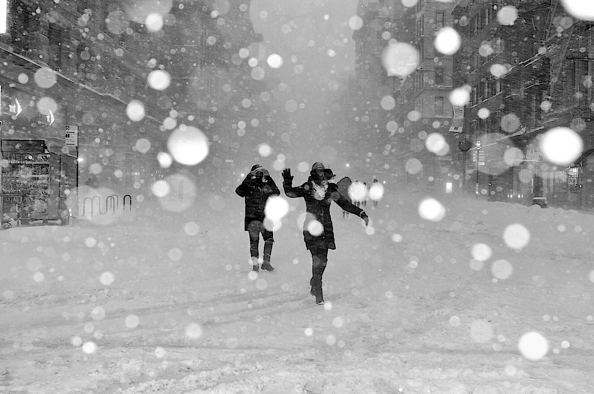 People smiling while walking in the snow