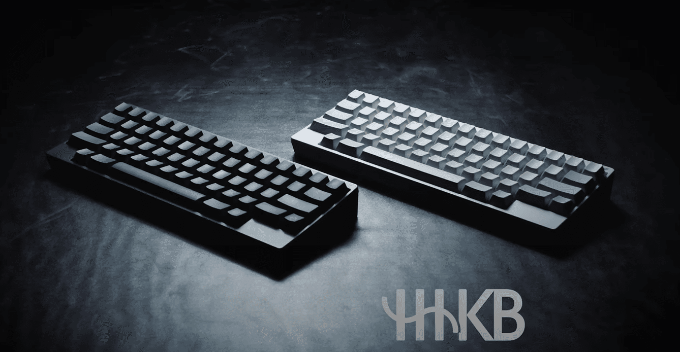 Two Happy hacking keyboards in white and black