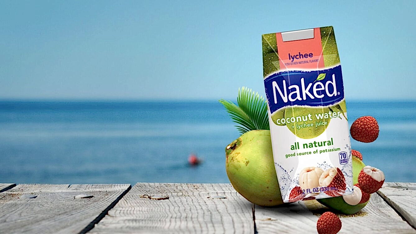 Naked Coconut Water on a dock by the water