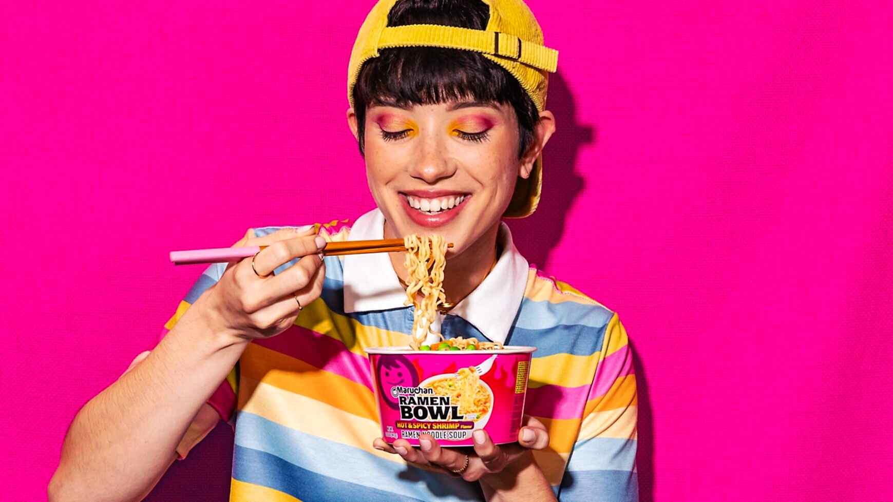 Person smiling while eating a ginormous bowl of Maruchan ramen